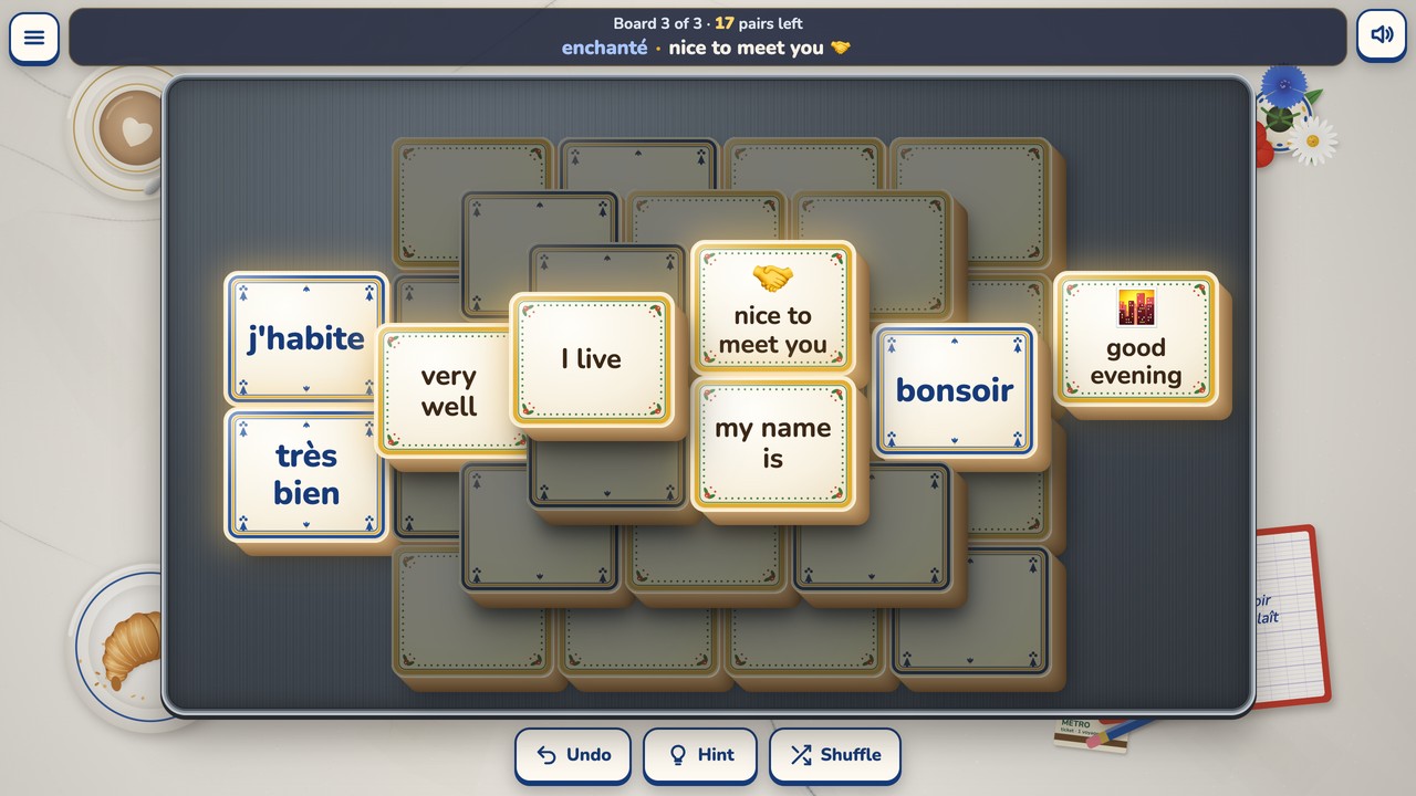 Board 3's four layers, each one a step up and to the left of the one below, with 17 pairs left and enchanté · nice to meet you just taken in the status bar. Bright free tiles include j'habite and I live, très bien and very well, bonsoir and good evening, and my name is.